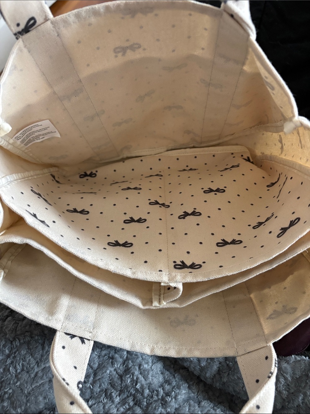Madden girl. Cream Bow-Print Canvas Tote Bag with Bear Charm. - Picture 6 of 15